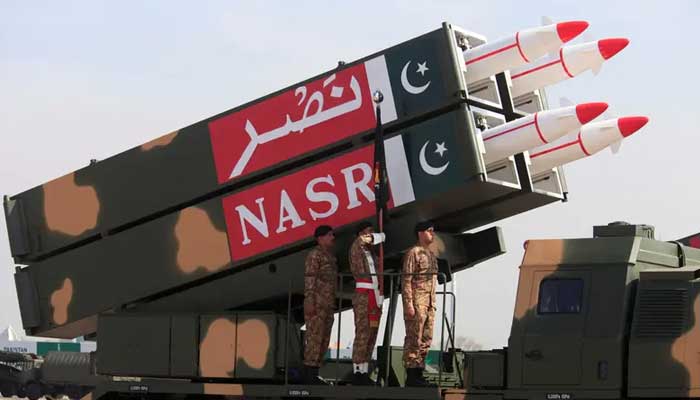 Pakistani military personnel stand beside short-range Surface to Surface Missile NASR during Pakistan Day military parade in Islamabad, Pakistan, March 23, 2017. — Reuters