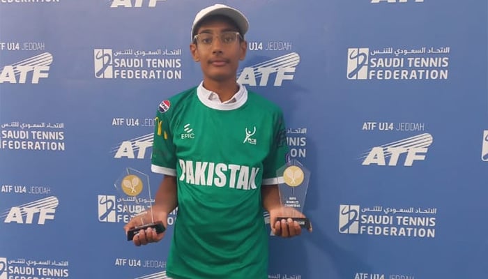 Pakistans Muhammad Hassan Usmani poses for a photo with trophies after winning singles and doubles titles at ATF U14 Jeddah. — Reporter