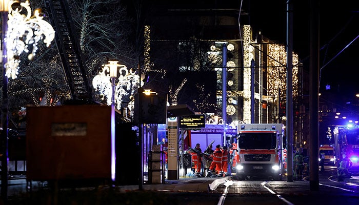 Emergency personnel work at a Christmas market after a car drove into a group of people, according to local media, in Magdeburg, Germany, December 21, 2024. — Reuters