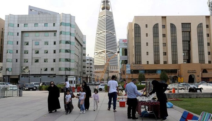 Visitors walk near the King Fahd Library, following an outbreak of coronavirus, in Riyadh, Saudi Arabia March 12, 2020. — Reuters