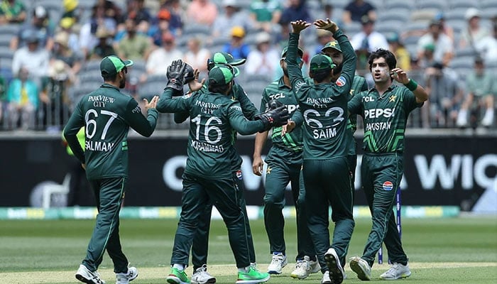 Pakistan players celebrate with Naseem Shah after he got the wicket of Australias Josh Inglis during the third one-day international (ODI) cricket match between Australia and Pakistan at the Perth Stadium in Perth on November 10, 2024. — AFP