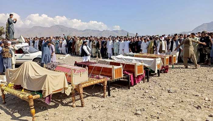 Local residents gather to offer funeral prayers for victims who were killed in a tribal clash, in Khyber Pakhtunkhwa’s Kurram district, on October 13, 2024. —AFP