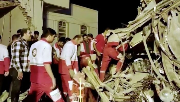 Rescuers work at the scene of a bus accident at Yazd province, Iran, in this still image taken from a video, August 21, 2024. —  Reuters