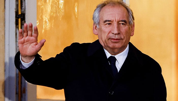 Newly appointed Prime Minister Francois Bayrou waves, on the day of the handover ceremony with Frances outgoing Prime Minister Michel Barnier at the Hotel Matignon in Paris, France, December 13, 2024. — Reuters