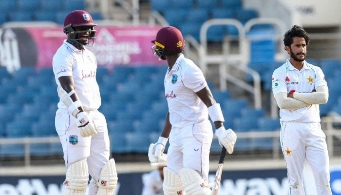 West Indian players react as Pakistans Hassan Ali looks on during a Test match. — AFP/File