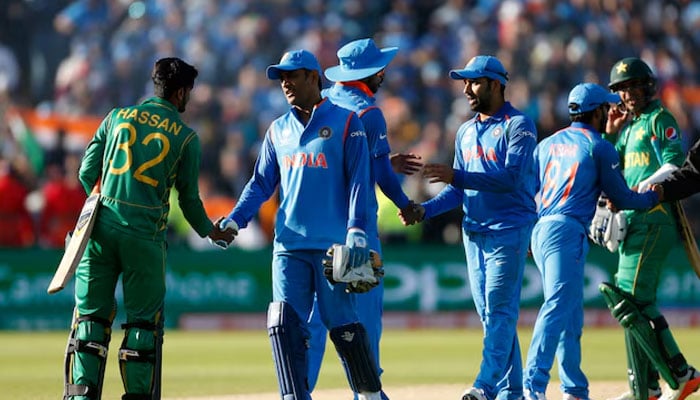 Pakistani and Indian players shake hands at the end of the match of Champions Trophy on June 4, 2017. — Reuters