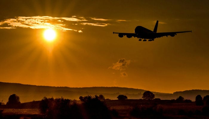 A representational image shows an aircraft in the sky. — Unsplash