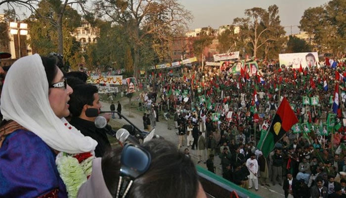 Former prime minister Benazir Bhutto speaks during a rally in the city of Rawalpindi shortly before she was killed in a gun and bomb attack, December 27, 2007. — Reuters