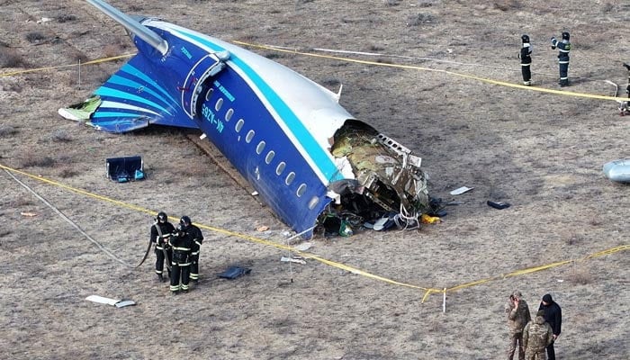 A drone view shows emergency specialists working at the crash site of an Azerbaijan Airlines passenger plane near the city of Aktau, Kazakhstan December 25, 2024. — Reuters