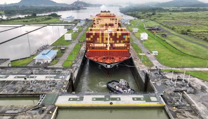 A cargo ship is passing through the Panama Canal. — AFP/File