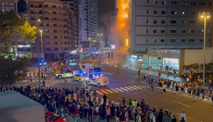 Ambulances and fire brigades seen in front of the building on fire near the Mall of Emirates on December 29, 2024.— Screengrab