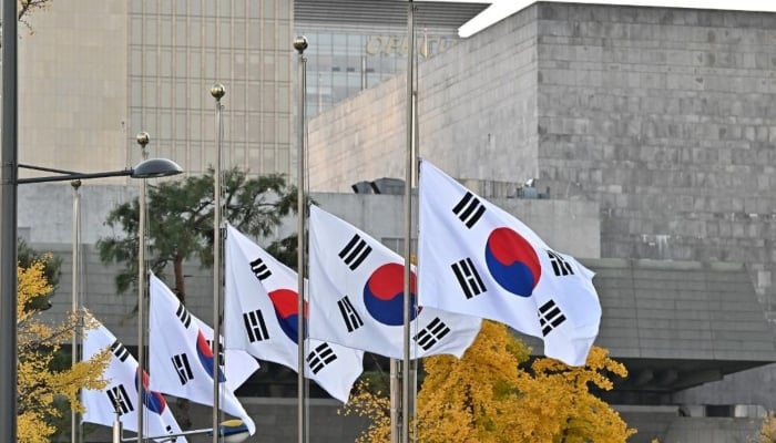 South Korean national flags flutter at half-mast at the government complex in Seoul, South Korea. — AFP/File