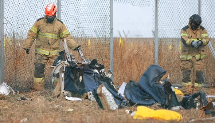 Recovery teams work at the scene where a Jeju Air Boeing 737-800 series aircraft crashed at Muan International Airport in Muan, on December 30, 2024. — AFP