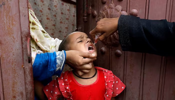 A girl receives polio vaccine drops, during an anti-polio campaign in Karachi, Pakistan July 20, 2020. — Reuters