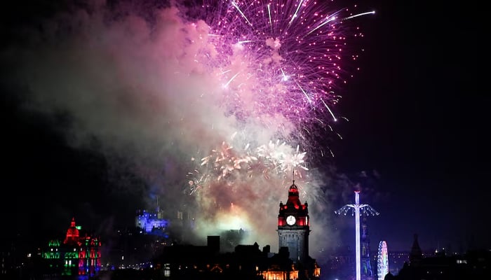 Fireworks light up the sky over Edinburgh Castle and the Balmoral Clock to mark the New Year, in Edinburgh, Scotland, Britain January 1, 2024. — Reuters