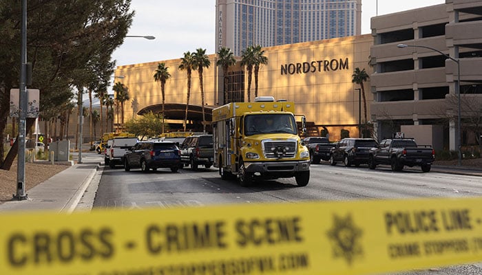 Firefighter vehicles are seen behind yellow tape in a cordoned area, after a Tesla Cybertruck burned at the entrance of Trump Tower, in Las Vegas, Nevada, U.S. January 1, 2025. — Reuters