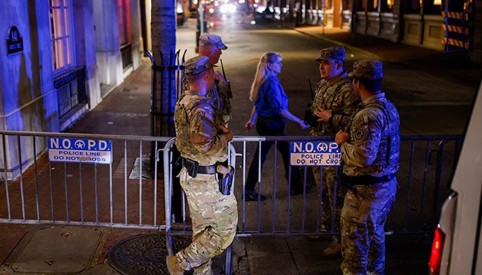 Military personnel interact near the site where people were killed by a man driving a truck in an attack during New Years celebrations, in New Orleans, Louisiana, US, January 1, 2025. — Reuters