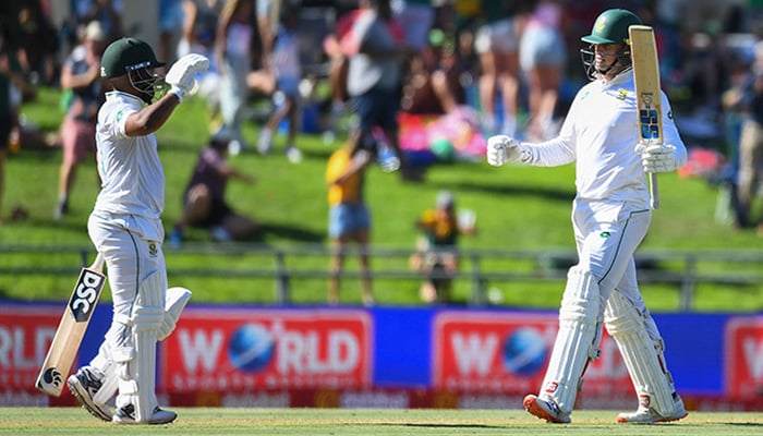 South Africas Ryan Rickelton (R) is congratulated by Temba Bavuma (L) after scoring a century and a half (150 runs) during the first day of the second international Test cricket match between South Africa and Pakistan at Newlands stadium in Cape Town on January 3, 2025. — AFP