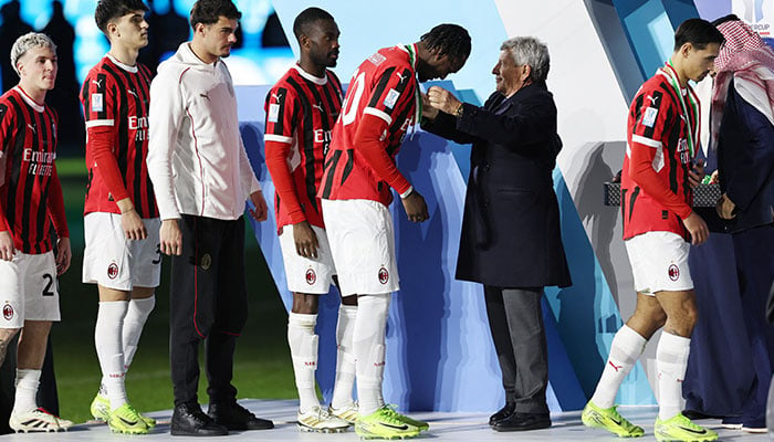 AC Milans Tammy Abraham collects his winners medal from Serie A president Ezio Simonelli during the trophy presentation after the Italian Super Cup final against Inter Milan at Al Awwal Park in Riyadh, Saudi Arabia on January 7, 2025. — Reuters