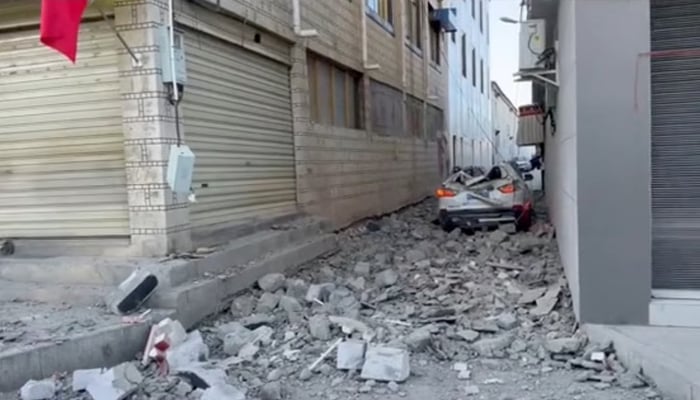 A damaged car lies amidst rubble on the street following an earthquake in Lhatse County, Shigatse City, Tibet Autonomous Region, China, January 7, 2025, in this screengrab obtained from a social media video. — Reuters