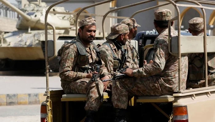 This undated photo shows army personnel are travelling onboard a vehicle. — Reuters