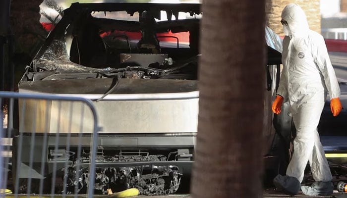 The remains of a Tesla Cybertruck that burned at the entrance of Trump Tower, are inspected in Las Vegas, Nevada, US on January 1, 2025. — Reuters