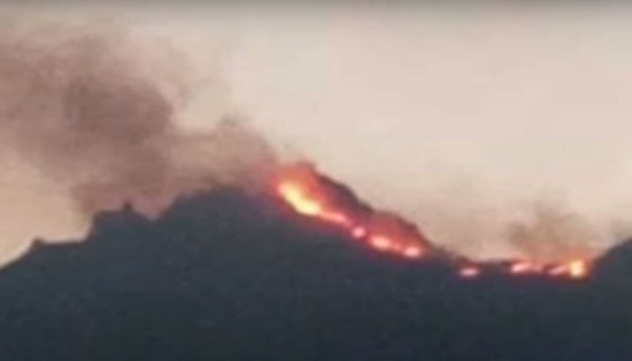 Fire can be seen on different locations on the mountains of the Sulaiman Range. — Screengrab via YouTube/Geo News/File