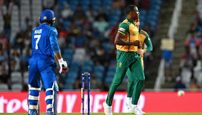 South Africas Kagiso Rabada (right) celebrates dismissing Afghanistans Mohammad Nabi (left) during ICC Mens T20 World Cup 2024 semi-final in Tarouba on June 26, 2024. — AFP