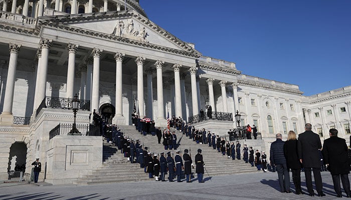 The flag-draped casket of former U.S. President Jimmy Carter is carried by a joint services military honour guard down the steps of the US Capitol in Washington, US, January 9, 2025. —  Reuters