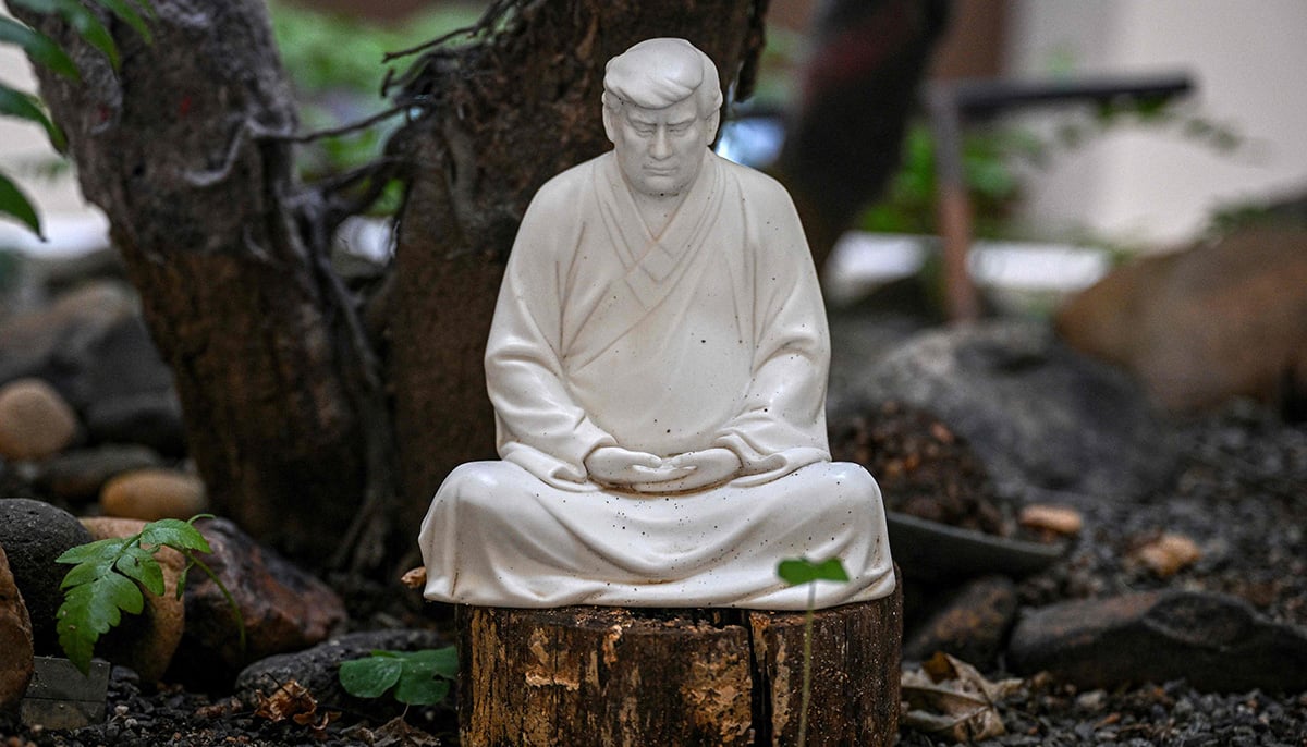 This photo taken on December 9, 2024 shows a sculpture of US president-elect Donald Trump in a pose evoking the Buddha at artist Hong Jinshis workshop in Xiamen, in southeastern Chinas Fujian province. — AFP