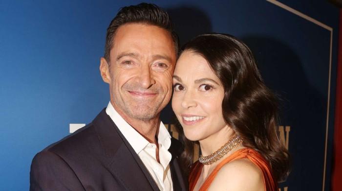 Hugh Jackman and Sutton Foster can’t keep hands off each other