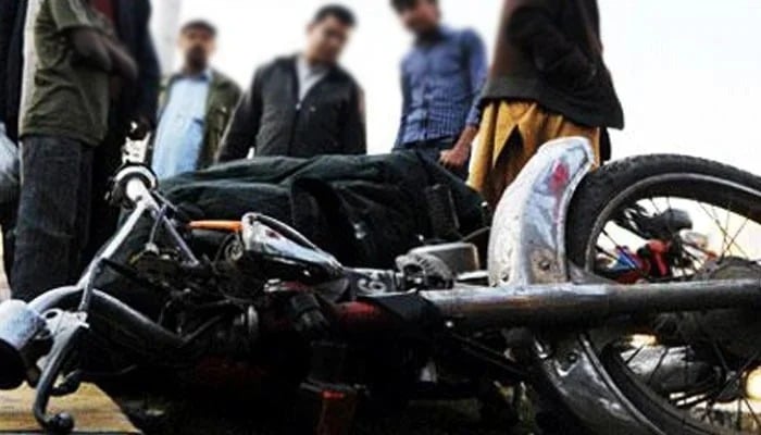 People are looking at the motorbike of a commuter. —AFP/ File