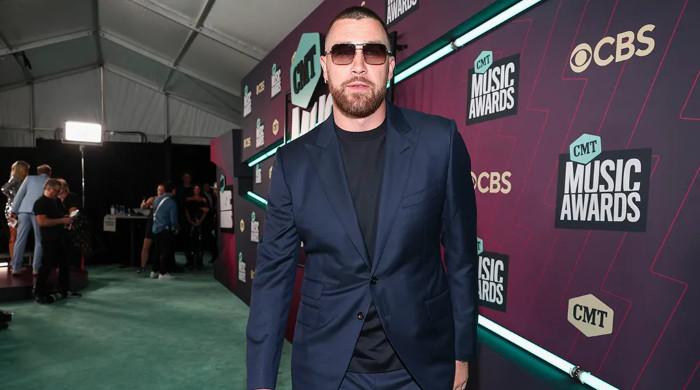 Travis Kelce’s stylist reveals that means behind pink carpet gesture