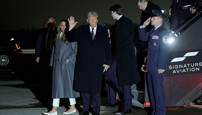 US President-elect Donald Trump, his wife Melania and son Barron arrive at Washington Dulles International Airport in Dulles, Virginia, US, January 18, 2025. — Reuters