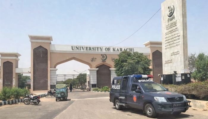 A police mobile van is parked in front of the Karachi University gate. — PPI/File