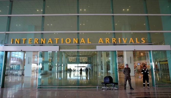 Airport Security Force (ASF) personnel stand guard at the international arrivals area at Islamabad International Airport, in Islamabad, April 18, 2018. — Reuters