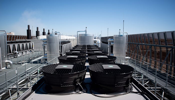 A photograph taken on July 8, 2020 shows cooler installations on the roof of the new MRS3 Interxion datacentre, in Marseille harbour, southern France. — AFP