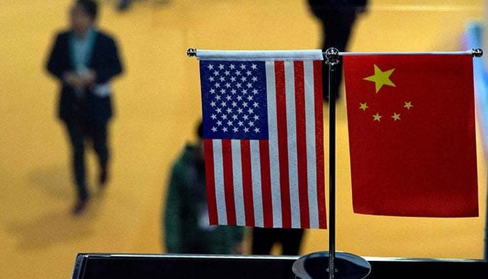 A representational image showing US and Chinese flags at an event. — AFP/File