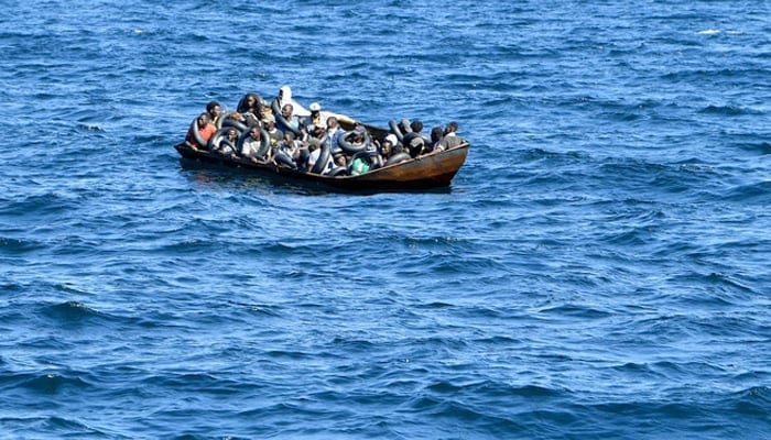 This representational image shows a boat carrying migrants. — AFP/File