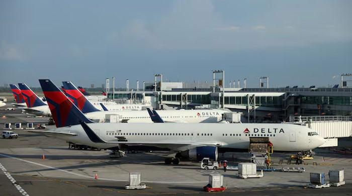 Eight hurt as plane flips on landing at Toronto airport