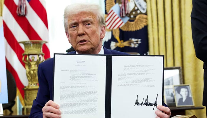 President Donald Trump holds an executive order about tariffs increase in the Oval Office of the White House in Washington, US on February 13, 2025. — Reuters