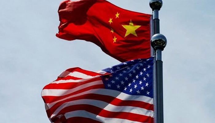 Chinese and US flags flutter near The Bund, before US trade delegation meet their Chinese counterparts for talks in Shanghai, China July 30, 2019. — Reuters