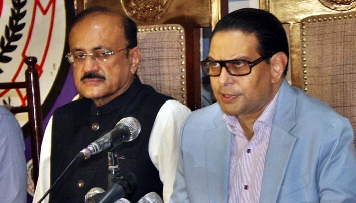 PTI Secretary General Salman Akram Raja (right) addresses a press conference at Lahore Press Club. — PPI/File