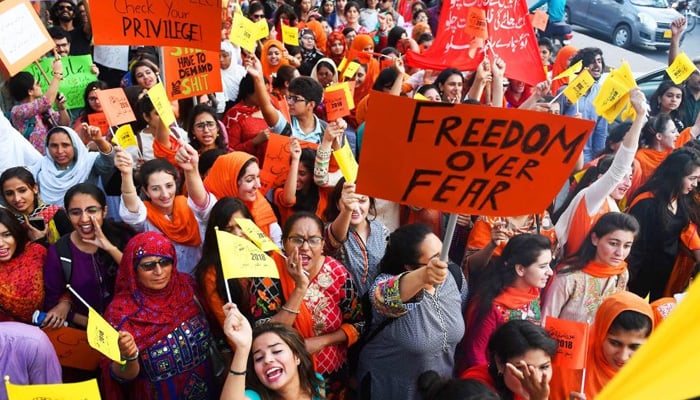 Pakistani civil society activists carry placards as they march during a rally to mark International Womens Day in Karachi. — AFP/File