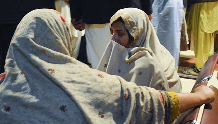 Passengers who were rescued from a train after it was attacked by militants, sit at the Railway Station in Quetta, Balochistan, March 12, 2025. — Reuters 